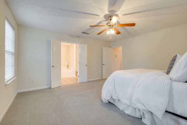 317 Sarava Ln, Smyrna, TN 37167 - bedroom featuring multiple windows, light carpet, ceiling fan, and ensuite bath