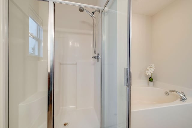 317 Sarava Ln, Smyrna, TN 37167 - bathroom featuring a shower stall and a bath