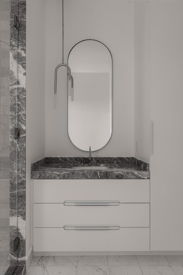 1616 W End Ave Unit 3304, Nashville, TN 37203 - full bath with marble look tile flooring, vanity, and a stall shower