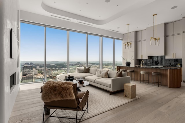 1616 W End Ave Unit 3304, Nashville, TN 37203 - living room with light wood-style flooring, a city view, and a high ceiling