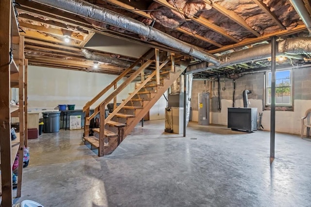 5455 Bales Rd, Cunningham, TN 37052 - basement featuring stairs, water heater, and heating unit