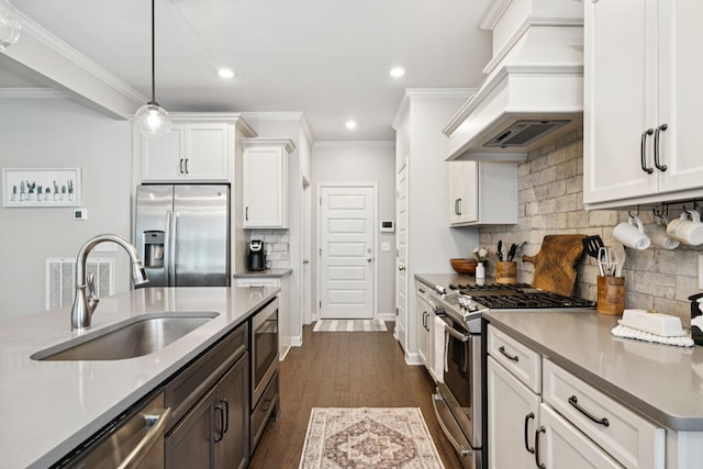 2717 Cloister Ln, Thompsons Station, TN 37179 - kitchen with stainless steel appliances, custom range hood, ornamental molding, white cabinetry, and tasteful backsplash