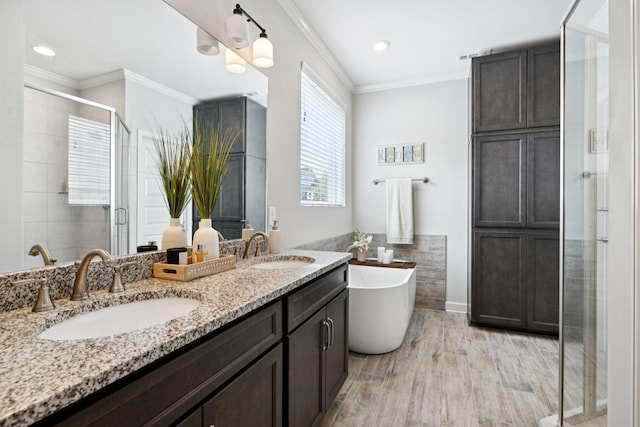 2717 Cloister Ln, Thompsons Station, TN 37179 - full bathroom with a stall shower, double vanity, a freestanding bath, crown molding, and tile walls