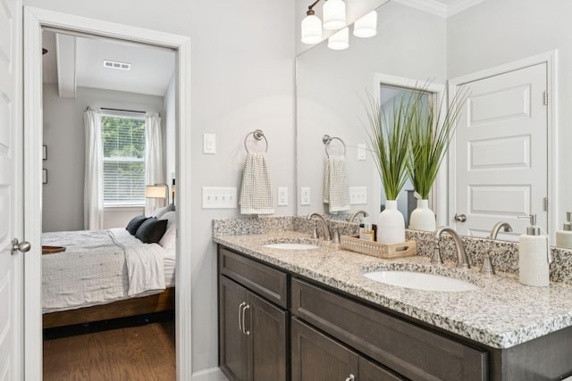 2717 Cloister Ln, Thompsons Station, TN 37179 - ensuite bathroom with double vanity, wood finished floors, crown molding, and a chandelier