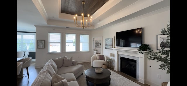 5614 Heirloom Dr, Murfreesboro, TN 37129 - living room featuring a tray ceiling, a chandelier, a fireplace, wood finished floors, and wooden ceiling