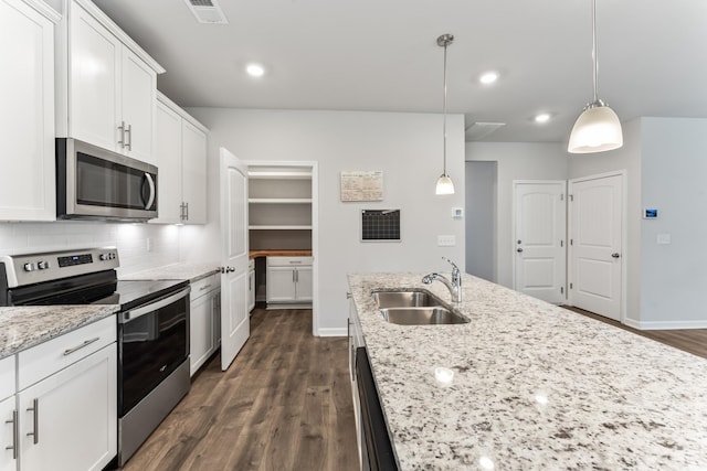 1045 Alta Vista Ln, Smyrna, TN 37167 - kitchen featuring stainless steel appliances, dark wood finished floors, white cabinetry, decorative backsplash, and pendant lighting