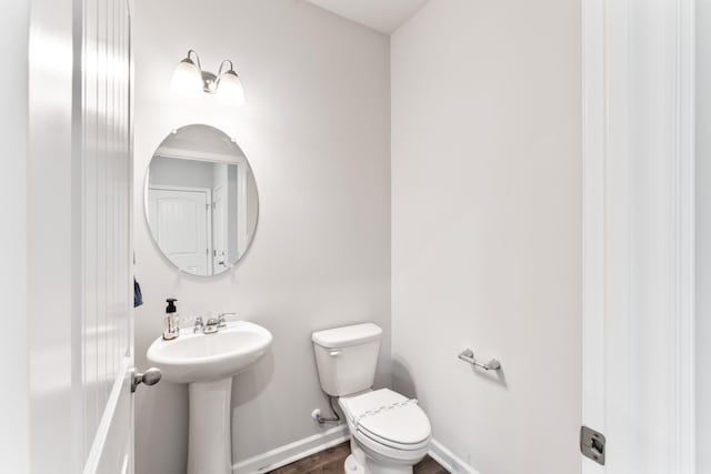 1045 Alta Vista Ln, Smyrna, TN 37167 - half bathroom featuring toilet and wood finished floors