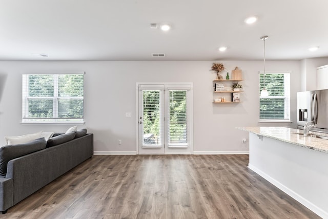 1045 Alta Vista Ln, Smyrna, TN 37167 - living area featuring wood finished floors, healthy amount of natural light, and recessed lighting