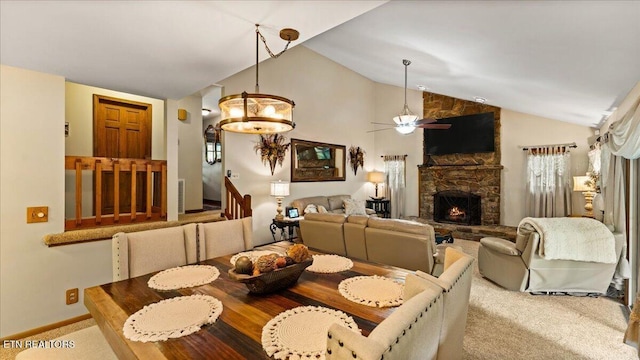 573 Hilltop Dr, Jacksboro, TN 37757 - dining space with lofted ceiling, a ceiling fan, healthy amount of natural light, and a stone fireplace