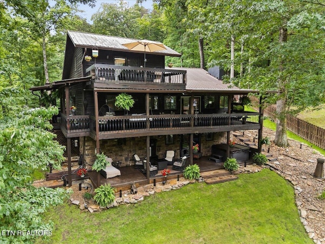 573 Hilltop Dr, Jacksboro, TN 37757 - back of property featuring a hot tub, a deck, a metal roof, a patio, and stone siding