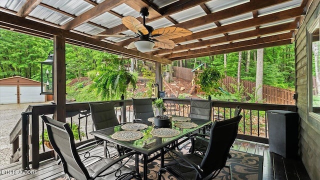 573 Hilltop Dr, Jacksboro, TN 37757 - wooden terrace with outdoor dining space, ceiling fan, an outbuilding, and a detached garage