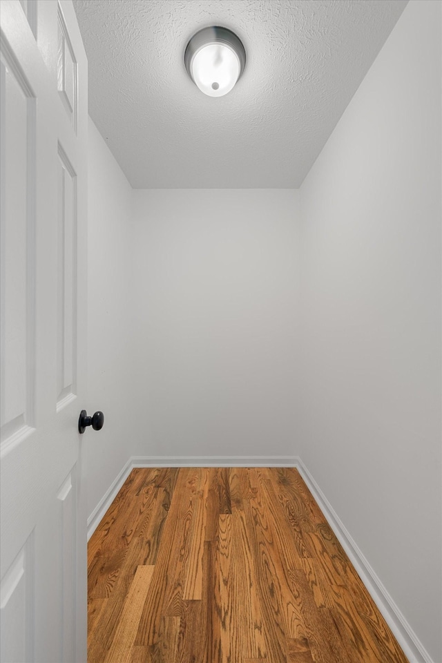 2746 Kinneys Rd, Cedar Hill, TN 37032 - spare room featuring wood finished floors and a textured ceiling