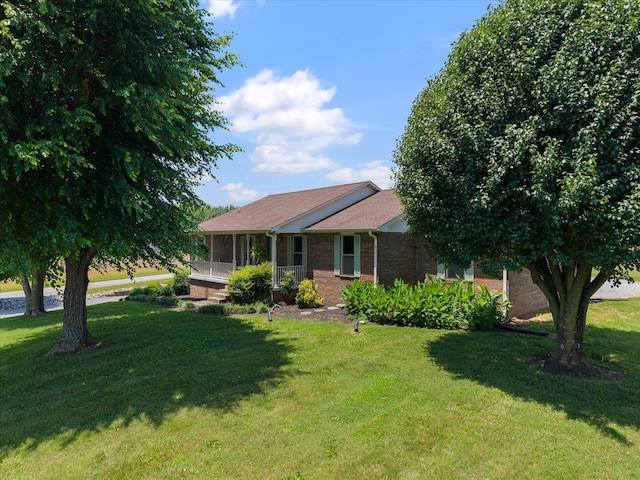 2746 Kinneys Rd, Cedar Hill, TN 37032 - ranch-style home featuring brick siding, a front lawn, and a porch