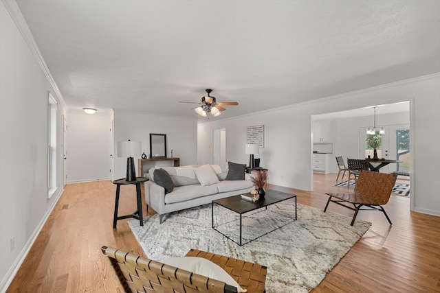 2746 Kinneys Rd, Cedar Hill, TN 37032 - living room featuring crown molding, light wood finished floors, and a ceiling fan