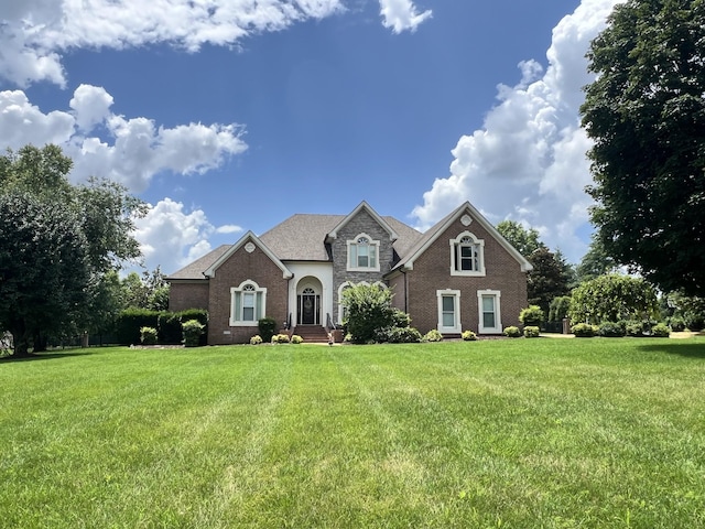 1515 Keystone Dr, Franklin, TN 37064 - view of front of house with a front yard, brick siding, and stone siding