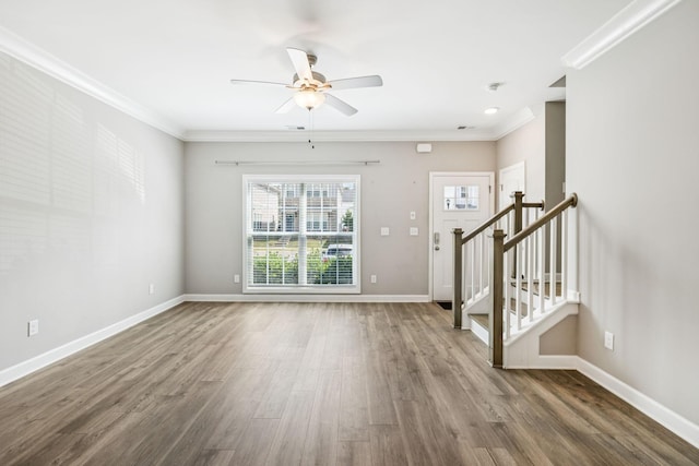 2557 Napa Valley Way, Columbia, TN 38401 - unfurnished living room with ceiling fan, wood finished floors, stairway, and crown molding