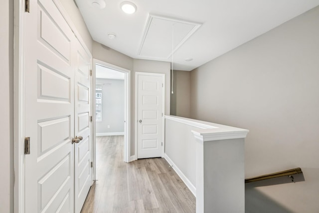 2557 Napa Valley Way, Columbia, TN 38401 - hallway with attic access, light wood-style floors, and an upstairs landing