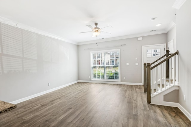 2557 Napa Valley Way, Columbia, TN 38401 - unfurnished living room featuring crown molding, a ceiling fan, stairs, and wood finished floors