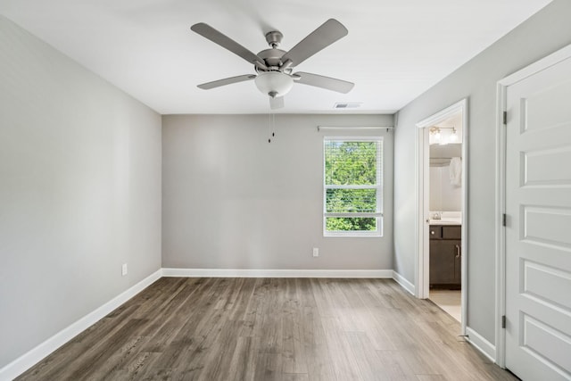 2557 Napa Valley Way, Columbia, TN 38401 - unfurnished bedroom featuring wood finished floors, ceiling fan, and ensuite bath