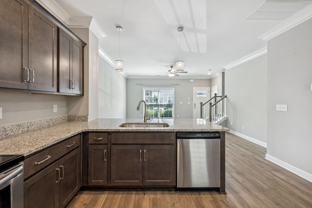 2557 Napa Valley Way, Columbia, TN 38401 - kitchen with stainless steel appliances, crown molding, a peninsula, dark brown cabinetry, and wood finished floors