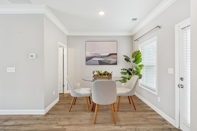 2557 Napa Valley Way, Columbia, TN 38401 - dining area with crown molding and light wood-style flooring