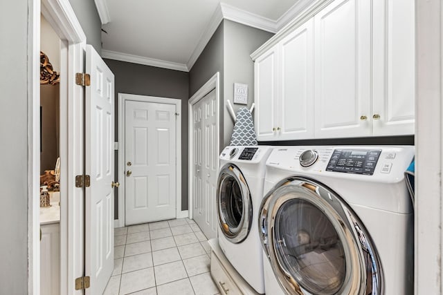 314 W 6th St, Columbia, TN 38401 - washroom featuring washing machine and dryer, ornamental molding, light tile patterned flooring, and cabinet space