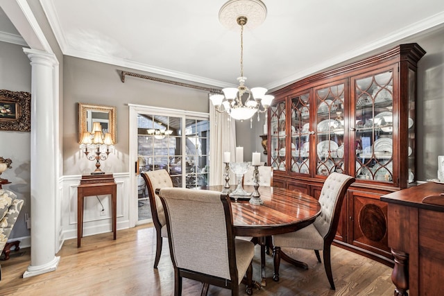 314 W 6th St, Columbia, TN 38401 - dining space featuring a chandelier, light wood-style flooring, ornamental molding, and decorative columns