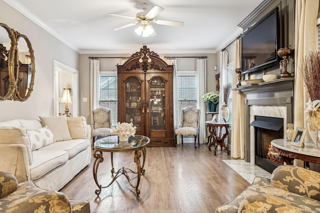 314 W 6th St, Columbia, TN 38401 - living area with light wood-style floors, a ceiling fan, a high end fireplace, and crown molding