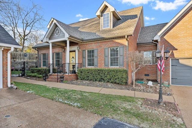 314 W 6th St, Columbia, TN 38401 - view of front facade with brick siding and a shingled roof