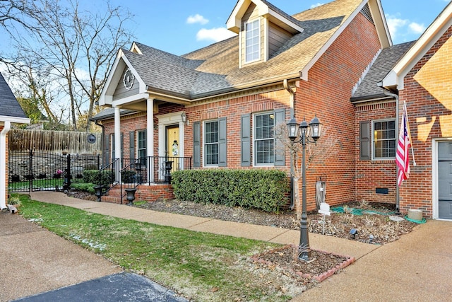 314 W 6th St, Columbia, TN 38401 - view of front of home with brick siding and roof with shingles