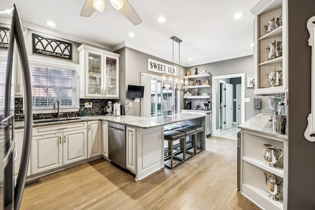 314 W 6th St, Columbia, TN 38401 - kitchen with open shelves, a peninsula, stainless steel appliances, plenty of natural light, and ornamental molding