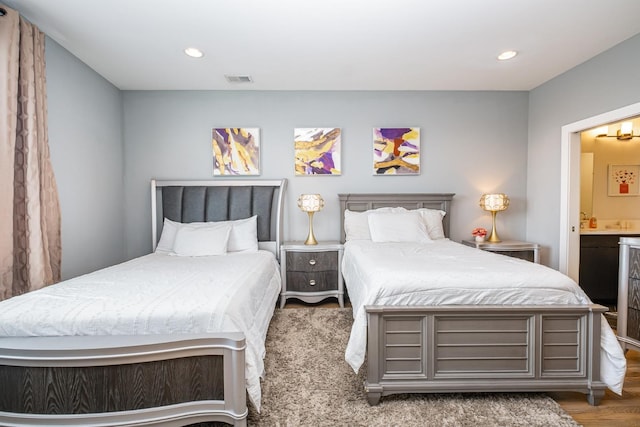 2910 Felicia St Unit 1, Nashville, TN 37209 - bedroom with recessed lighting, ensuite bath, and wood finished floors
