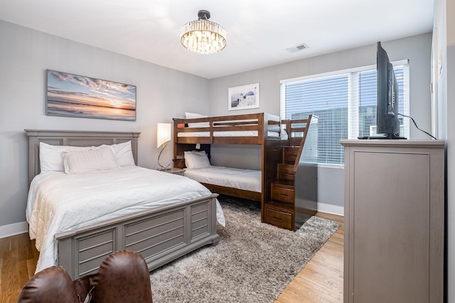 2910 Felicia St Unit 1, Nashville, TN 37209 - bedroom with wood finished floors and a chandelier