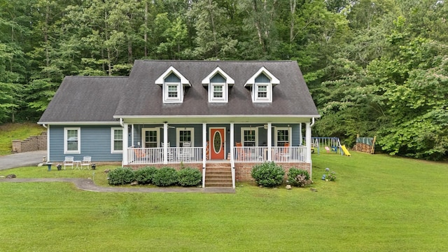 4200 Happy Valley Rd, Flintstone, GA 30725 - cape cod home with a porch, a front yard, a wooded view, and a playground