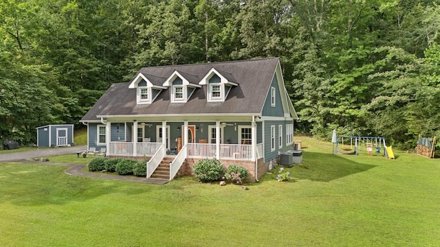 4200 Happy Valley Rd, Flintstone, GA 30725 - cape cod home with covered porch, a front lawn, a storage unit, and a forest view
