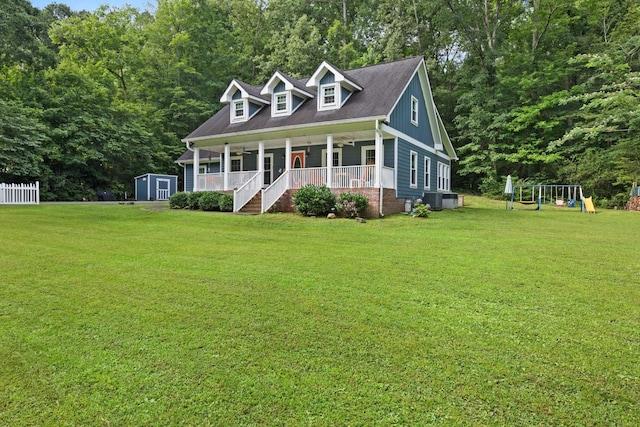 4200 Happy Valley Rd, Flintstone, GA 30725 - cape cod house with a porch, a front lawn, a playground, and a storage shed