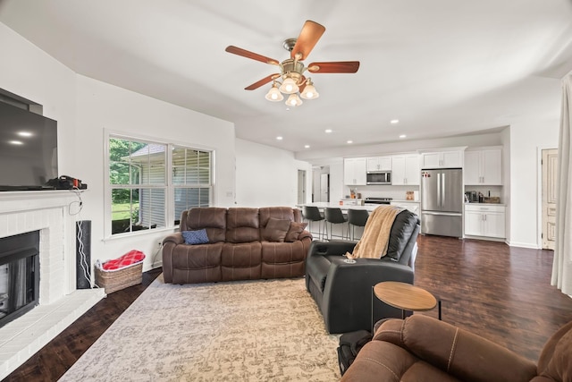 516 Delacy Dr, Fairview, TN 37062 - living area with dark wood-type flooring, ceiling fan, recessed lighting, and a fireplace