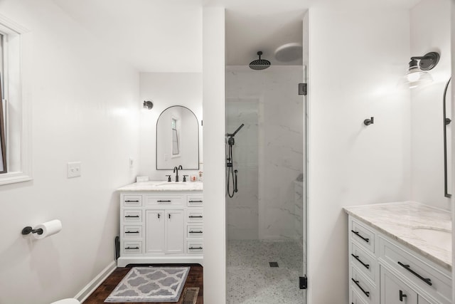 516 Delacy Dr, Fairview, TN 37062 - bathroom featuring a marble finish shower, vanity, and wood finished floors
