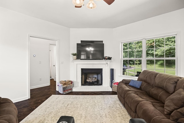 516 Delacy Dr, Fairview, TN 37062 - living area with dark wood-style flooring, a fireplace, and a ceiling fan