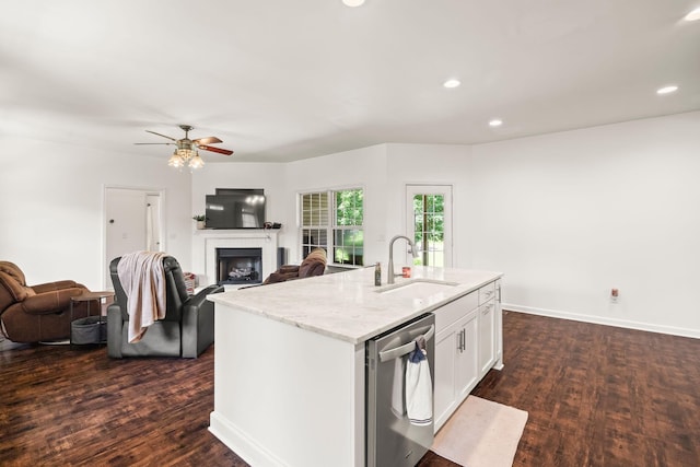 516 Delacy Dr, Fairview, TN 37062 - kitchen with stainless steel dishwasher, dark wood finished floors, a fireplace, open floor plan, and recessed lighting
