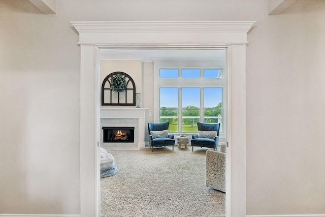 1731 Hudson Rd, Madison, TN 37115 - carpeted living room featuring a fireplace with flush hearth and ornamental molding