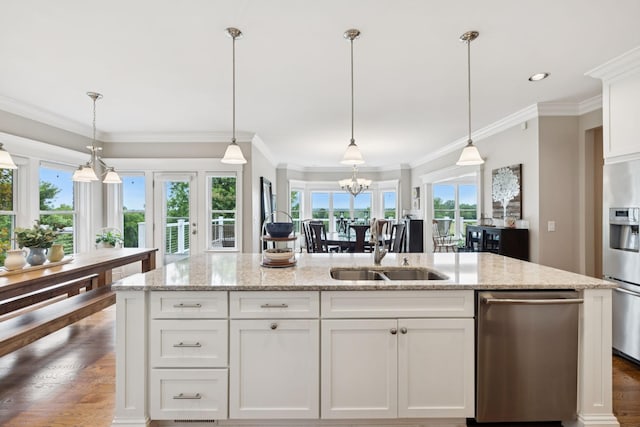 1731 Hudson Rd, Madison, TN 37115 - kitchen featuring stainless steel appliances, a kitchen island with sink, white cabinetry, light stone counters, and a chandelier