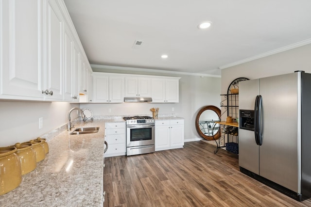 1731 Hudson Rd, Madison, TN 37115 - kitchen featuring stainless steel appliances, under cabinet range hood, ornamental molding, white cabinets, and wood finished floors