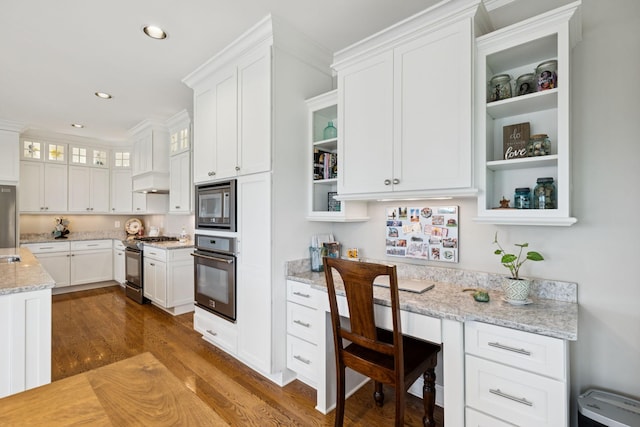 1731 Hudson Rd, Madison, TN 37115 - kitchen with stainless steel appliances, white cabinetry, dark wood-style floors, glass insert cabinets, and recessed lighting