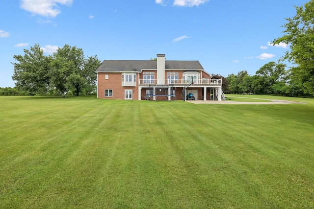 1731 Hudson Rd, Madison, TN 37115 - rear view of house with a deck, a lawn, and a chimney