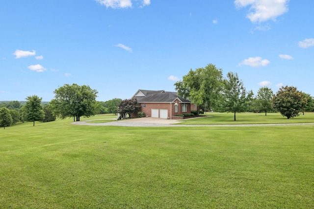 1731 Hudson Rd, Madison, TN 37115 - view of green lawn featuring driveway, a garage, and golf course view