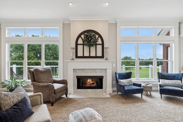 1731 Hudson Rd, Madison, TN 37115 - carpeted living room featuring crown molding, a fireplace with flush hearth, healthy amount of natural light, and recessed lighting