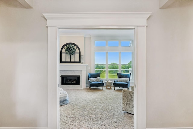 1731 Hudson Rd, Madison, TN 37115 - carpeted living room featuring a fireplace with flush hearth and crown molding
