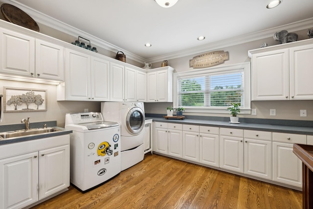 1731 Hudson Rd, Madison, TN 37115 - laundry area featuring cabinet space, washer and dryer, crown molding, recessed lighting, and light wood-style floors