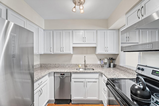 2116 Hobbs Rd Unit K2, Nashville, TN 37215 - kitchen featuring stainless steel appliances, white cabinetry, exhaust hood, and light stone counters